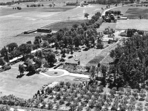 Aerial view of the entire Pinehurst farm looking south southeast toward the signature dairy barns taken prior to 1942. What is now Highway 32 is the road at left. Highway 28 does not yet exist--it later bisects the property. (Photo: Submitted)