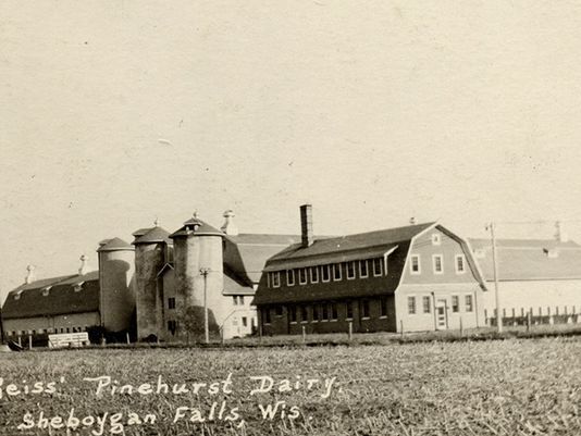 This is a classic view of the dairy complex at Pinehurst Farms in post card form. At one point the dairy had seven barns and seven houses on 500 acres. The water tower, erected in 1912, stood 125 feet above the barns and cows it served. (Photo: Submitted)